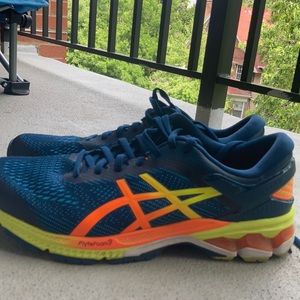 Men’s ASICS running shoes. Blue, yellow, orange